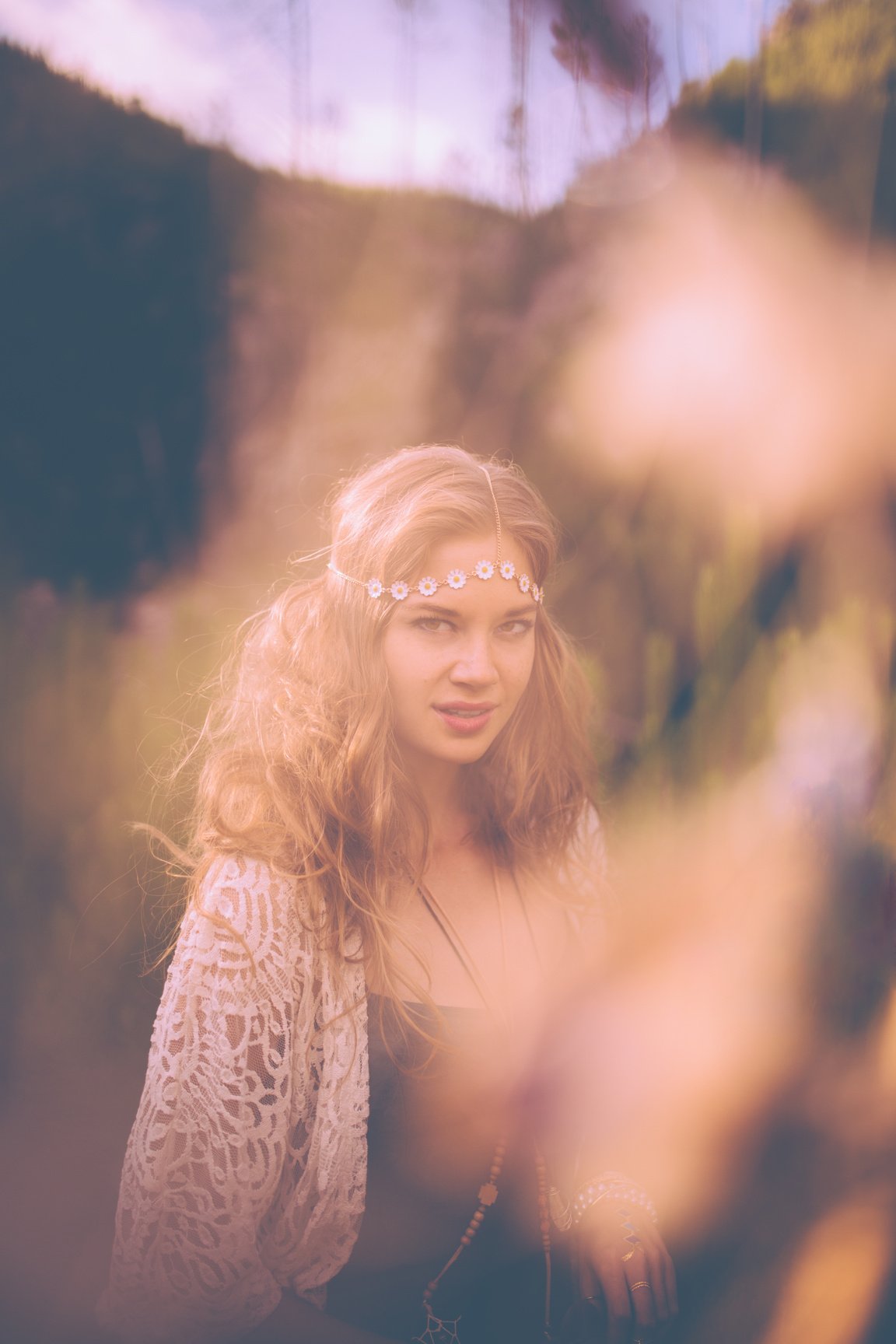 Boho girl in vintage dress walking in nature